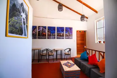 a living room with a couch and a table at CASONA TORDO - A 3 Cdras de la Plaza - Habitaciones con baño privado in Cusco