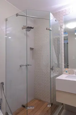 a glass shower in a bathroom with a sink at Hotel & Hacienda La Caravedo in Ica