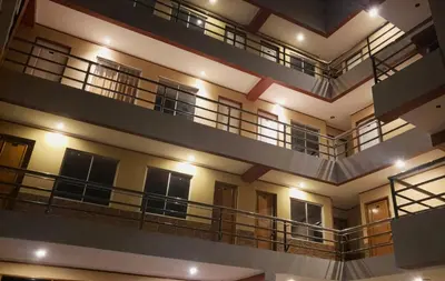 a view of a building with balconies and lights at Hotel Manantial in Churín