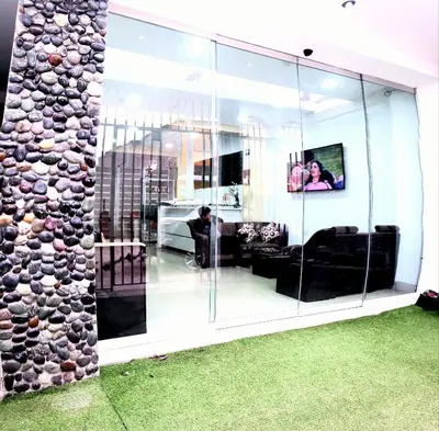 a living room with a large glass wall at Hospedaje Pueblo Viejo in Casa Blanca