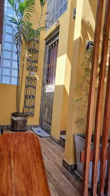 a room with a yellow building with a potted plant at luxury Andino Ciudad real & 1 bed in Lima