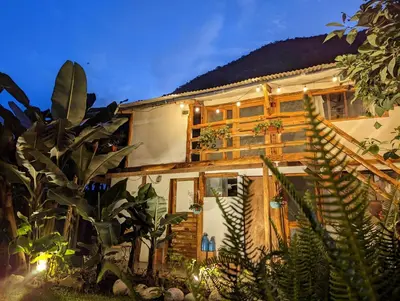 a house with plants in front of it at FRANKFURTER HOF FAMILIAR Oxapampa in Oxapampa