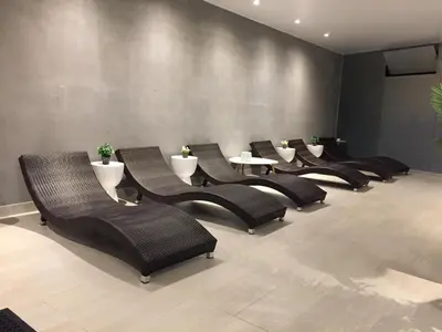 a row of chairs and tables in a waiting room at Vive - Descansa - Disfruta in San Bartolo