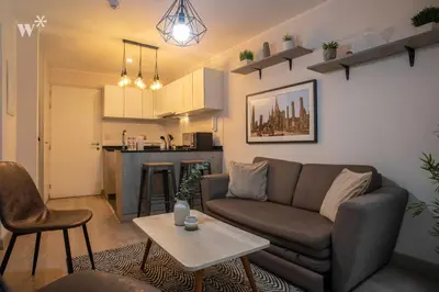 a living room with a couch and a table at Osma by Wynwood House in Lima