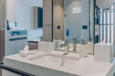 a bathroom with a sink and a mirror at SOUMA Hotel, Vignette Collection by IHG in Lima