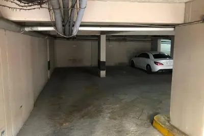 a parking garage with a car parked in it at 7-Departamento moderno en el área turística de Miraflores in Lima