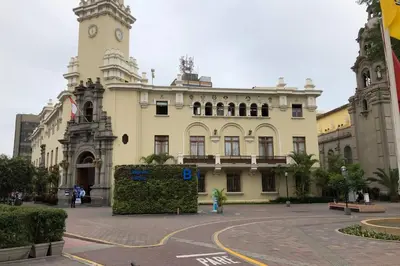 a large building with a clock tower on top of it at 7-Departamento moderno en el área turística de Miraflores in Lima