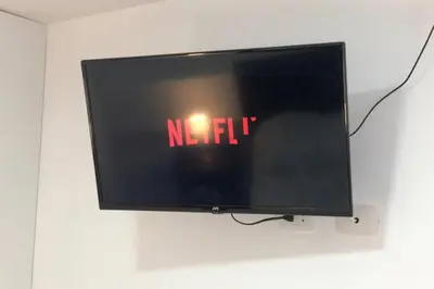 a flat screen tv with the word netflix on it at (5)Modern Miraflores tourist area apartment in Lima