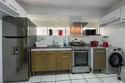 a kitchen with a refrigerator and a dishwasher at (4)Acogedor departamento, excelente ubicación in Lima