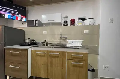 a kitchen with a sink and a refrigerator at 4B Mini-departamento nuevo en centro de Miraflores in Lima