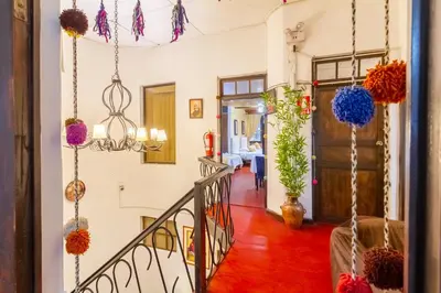 a staircase in a house with colorful decorations at Hotel Campanario in Cusco