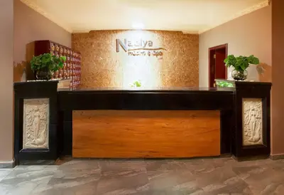 a lobby with a wooden door in a building at Kingdom Hotel in Lima