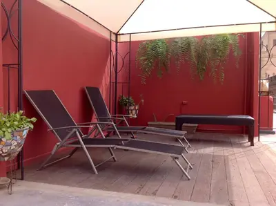 a couple of chairs sitting on a patio at Hospedaje Santa Rosa- Centro Histórico in Lima