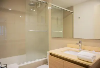 a bathroom with a sink and a shower at Martinto 114 by Wynwood House in Lima