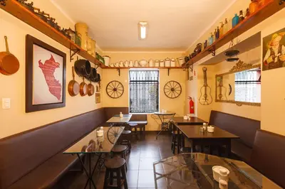 a room with tables and chairs in a restaurant at Casa Suyay in Lima