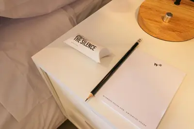 a pen sitting on top of a book on a table at Reducto 825 by Wynwood House in Lima