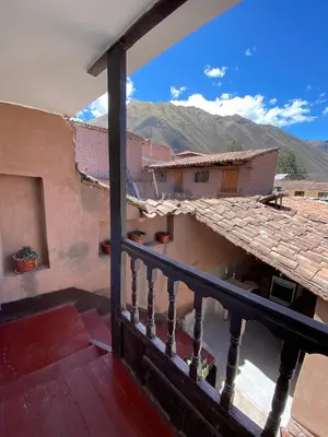 a view from a balcony of a house with mountains at CASA ANDINA PRIVADA a lado del Museo - Qespiwanka in Urubamba