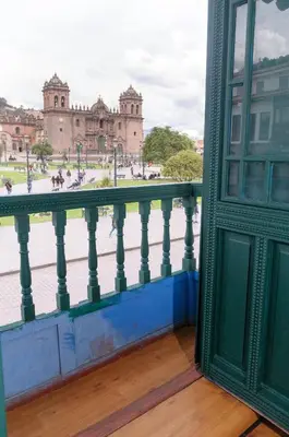 a balcony with a view of a building at Hostal Chasky in Cusco