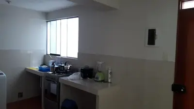 a kitchen with a sink and a counter top at Hermoso departamento en chorrillos in Lima