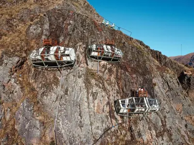 a group of cars on top of a mountain at Vertical Sky Suites in Ollantaytambo