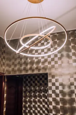 a circular light fixture hanging from the ceiling in a kitchen at Lima Central Design Hotel Spa & Club in Lima
