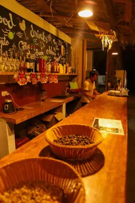a bar with a bowl of food on a counter at Vertikal lodge in Santa Teresa
