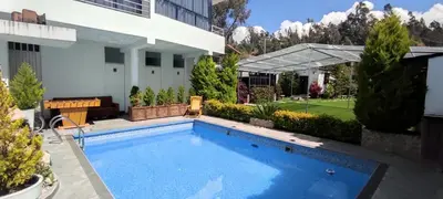 a swimming pool in the backyard of a house at Villa blanca in Andahuaylas