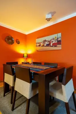 a dining room with a table and chairs at Balconcito Peruano & AMPLIO 2 dormitorios in Lima