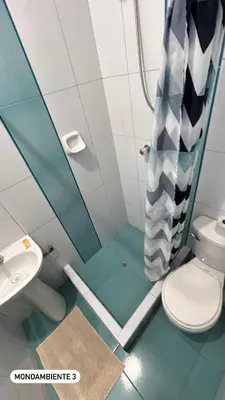 a bathroom with a toilet and a sink at El Viejo Roble in Cusco