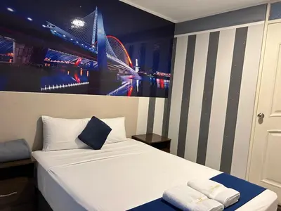 a bed in a room with a picture of a stadium at GOLDEN DREAM´S in Lima
