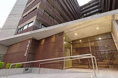 a entrance to a building with a revolving door at ✶ Nazca Penthouse ✶ 3-stories LUXURY Rooftop Pool in Lima