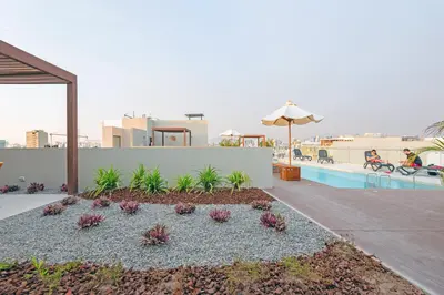 a backyard with a pool and a garden with plants at ✶ Pisac Penthouse ✶ 3-stories LUXURY Rooftop Pool in Lima