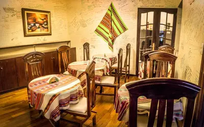 a group of tables and chairs in a restaurant at Llaqta Wasi in Lima