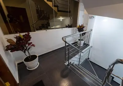 a bathroom with a potted plant on the floor at Moderno Departamento en Barranca in Barranca