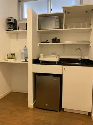a kitchen with a sink and a counter top at Suite en San Isidro-Frente al Supermercado Vivanda in Lima