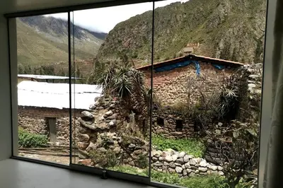 a view of a building from a window at APARMENT SAMANA HOUSE OLLANTAYTAMBO in Ollantaytambo