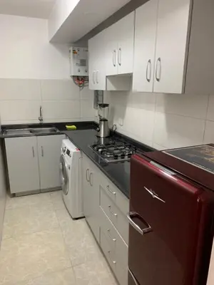 a kitchen with a stove and a washing machine at Miraflores Center - Larcomar, Parque Kennedy, Malecón in Lima