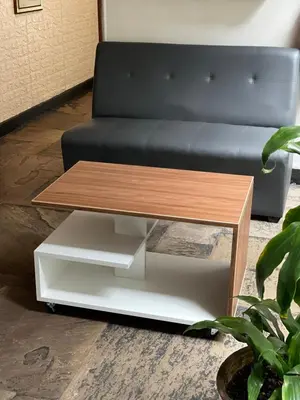 a coffee table in a living room with a black couch at Miraflores Center - Larcomar, Parque Kennedy, Malecón in Lima