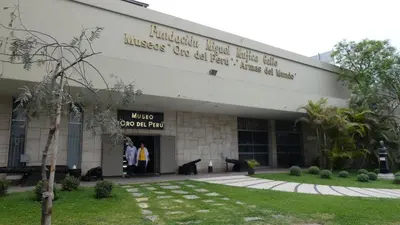 a building with people standing outside of it at Beautiful Penthouse in Lima, in front of the park in Lima