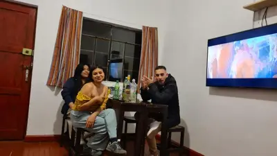 a group of people sitting at a table at SK Hostal in Cusco