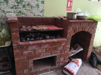 a brick oven with food inside of it at Hostal Sol de Chosica in Chosica