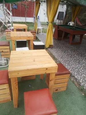 a picnic table and chairs with a table and a pool table at Hostal Sol de Chosica in Chosica