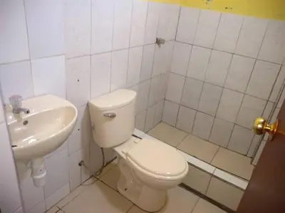 a bathroom with a toilet and a sink at 101 Comfy Apt WiFi kitchen SmartTV Central at Callao in Lima