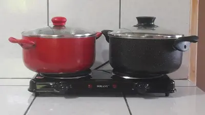 a pot and a container on a stove at 101 Comfy Apt WiFi kitchen SmartTV Central at Callao in Lima