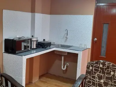 a small kitchen with a sink and a microwave at 402 Comfy Apt WiFi kitchen SmartTV Central at Callao in Lima