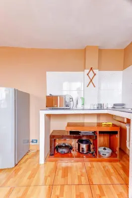 a kitchen with two pots on a wooden floor at 402 Comfy Apt WiFi kitchen SmartTV Central at Callao in Lima