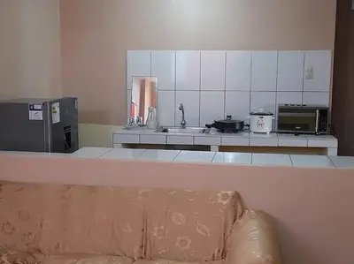 a kitchen with a sink and a counter with a couch at 301 Comfy Apt WiFi kitchen SmartTV Central at Callao in Lima