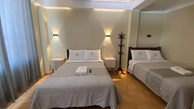 a bedroom with two beds and a window at HOTEL MAR Y LAGO in Lunahuaná