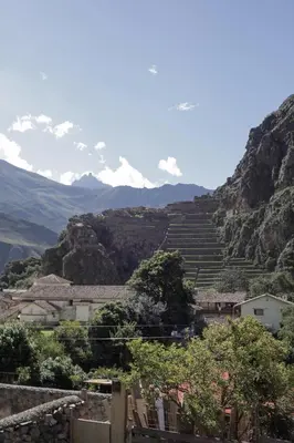 a view of a village with mountains in the background at Doña Catta Casa Boutique in Ollantaytambo