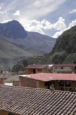 a view of a village with mountains in the background at Doña Catta Casa Boutique in Ollantaytambo
